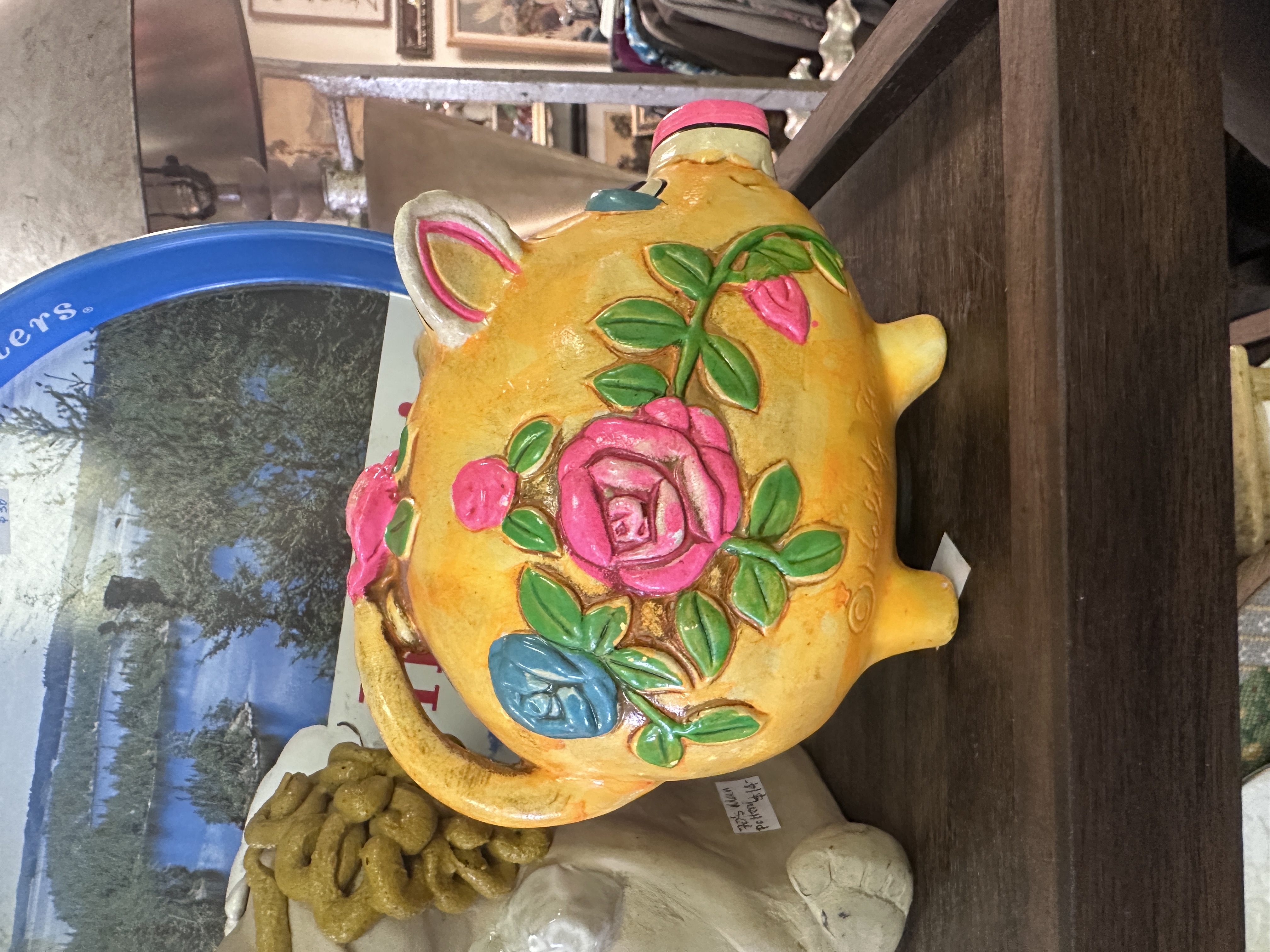 Yellow floral pig-shaped ceramic bank with raised roses